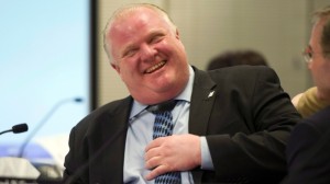 Rob Ford ri durante a reunião do Conselho Executivo, na Câmara Municipal em Toronto - 22 de janeiro de 2014. (Frank Gunn/The Canadian Press)