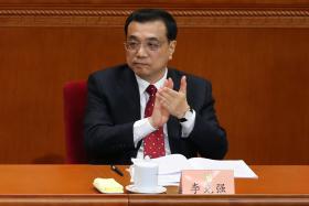 CHINA ABRANDOU, MAS “A QUALIDADE DO CRESCIMENTO ECONOMICO AUMENTOU”, DIZ PRIMEIRO-MINISTRO