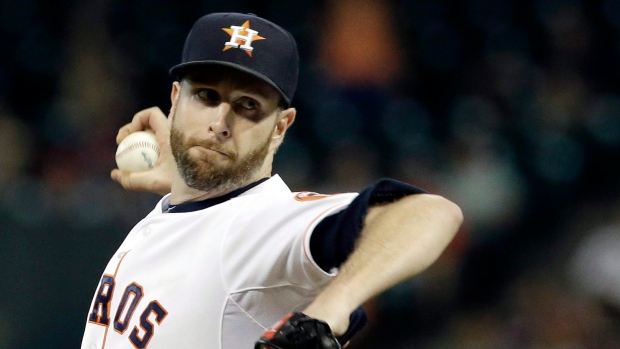 Scott Feldman dos Houston Astros, durante um jogo de basebol. (AP Photo / Pat Sullivan)