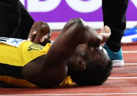 BOLT LESIONA-SE NA CORRIDA FINAL NOS MUNDIAIS ATLETISMO