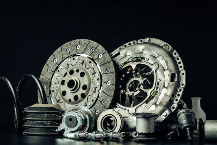 Close up of new car parts on black background