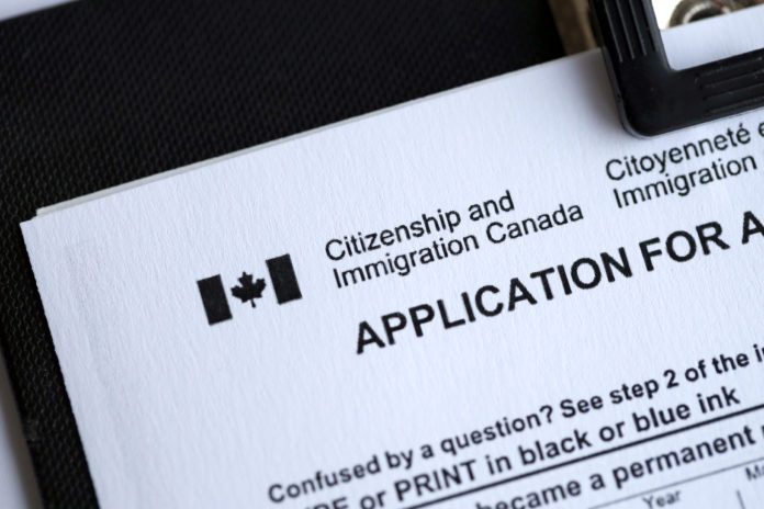 Citizenship and Immigration Canada inscription and small canadian flag