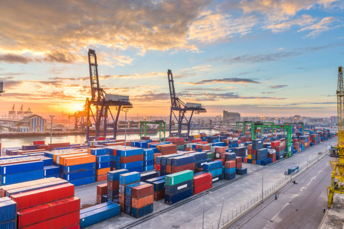 Casablanca, Morocco industrial shipping port at dawn.