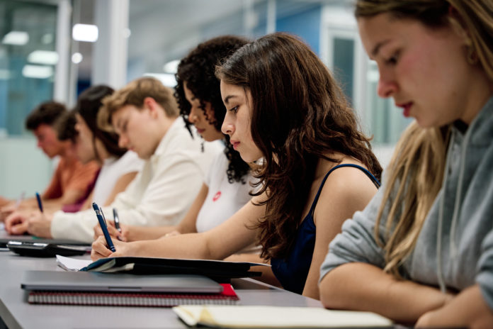 Diverse students studying in a university classroom