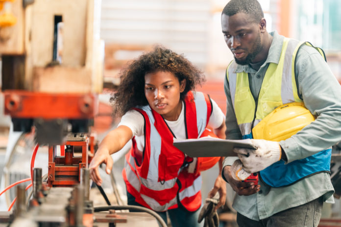 African American industrial experts inspection collaborate in factory, machinery technical
