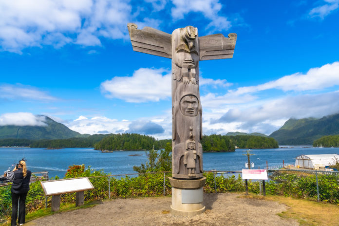 Traditional totem pole standing tall in tofino, vancouver island